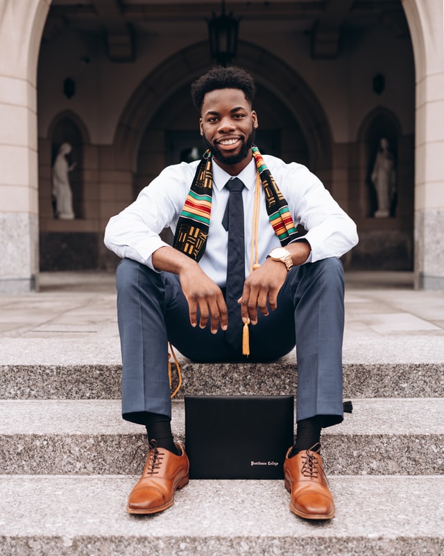 An image of a smiling graduate student